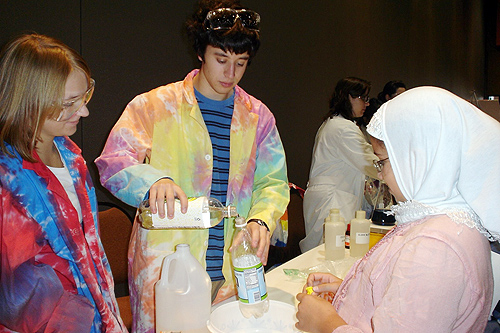 At left, Tresne Hernandez '12 and Ross Firestone '12 demonstrate how to blow up a balloon with baking soda and vinegar by producing carbon dioxide. The students are part of the Chemistry Department's Free Radicals group, which participated in the Muslim Coalition of Connecticut’s Carnival to commemorate the end of Ramadan in October.