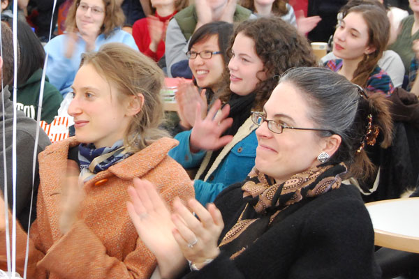 Suzanna Tamminen, front, director of the Wesleyan University Press, applauds Obama's talk. (Photo by Olivia Bartlett).