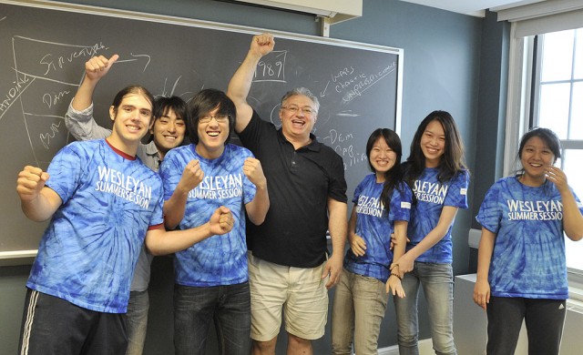 Wesleyan offers an intensive Summer Session in which students can complete semester-long courses in only five weeks. Pictured above is the international politics class on June 14 sporting their Summer Session t-shirts. Pictured in the center is the course's instructor Giulio Gallarotti, professor of government, tutor in the College of Social Studies.