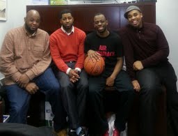 From left, Jason Forde '01, Terrance Williams '02, Andre Charles '06, Justin Weir '02 work with an afterschool program devoted to developing student athletes academically, socially and athletically.