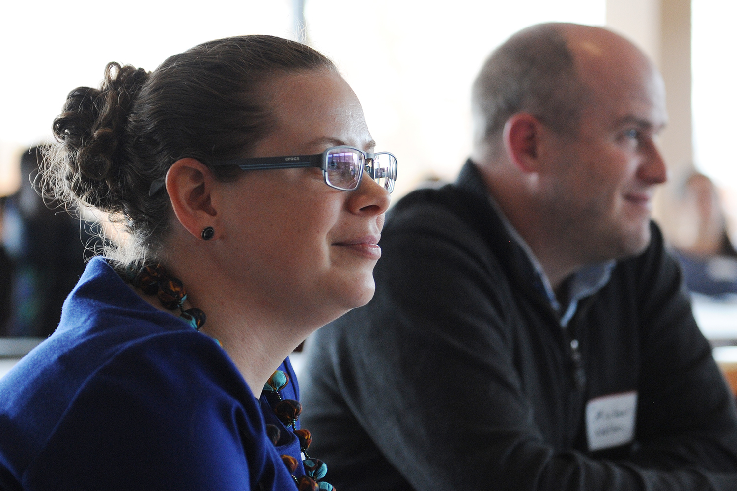 Laura Ann Twagira, assistant professor of history, and Michael Nelson, assistant professor of government, listen to the panel on children and youth. 