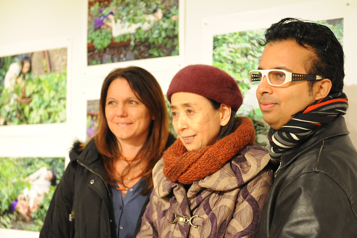 From left, Katja Kolcio, associate professor of dance, associate professor of environmental studies; Eiko Otake; and Hari Krishnan, assistant professor of dance, mingle at the exhibit's opening. 