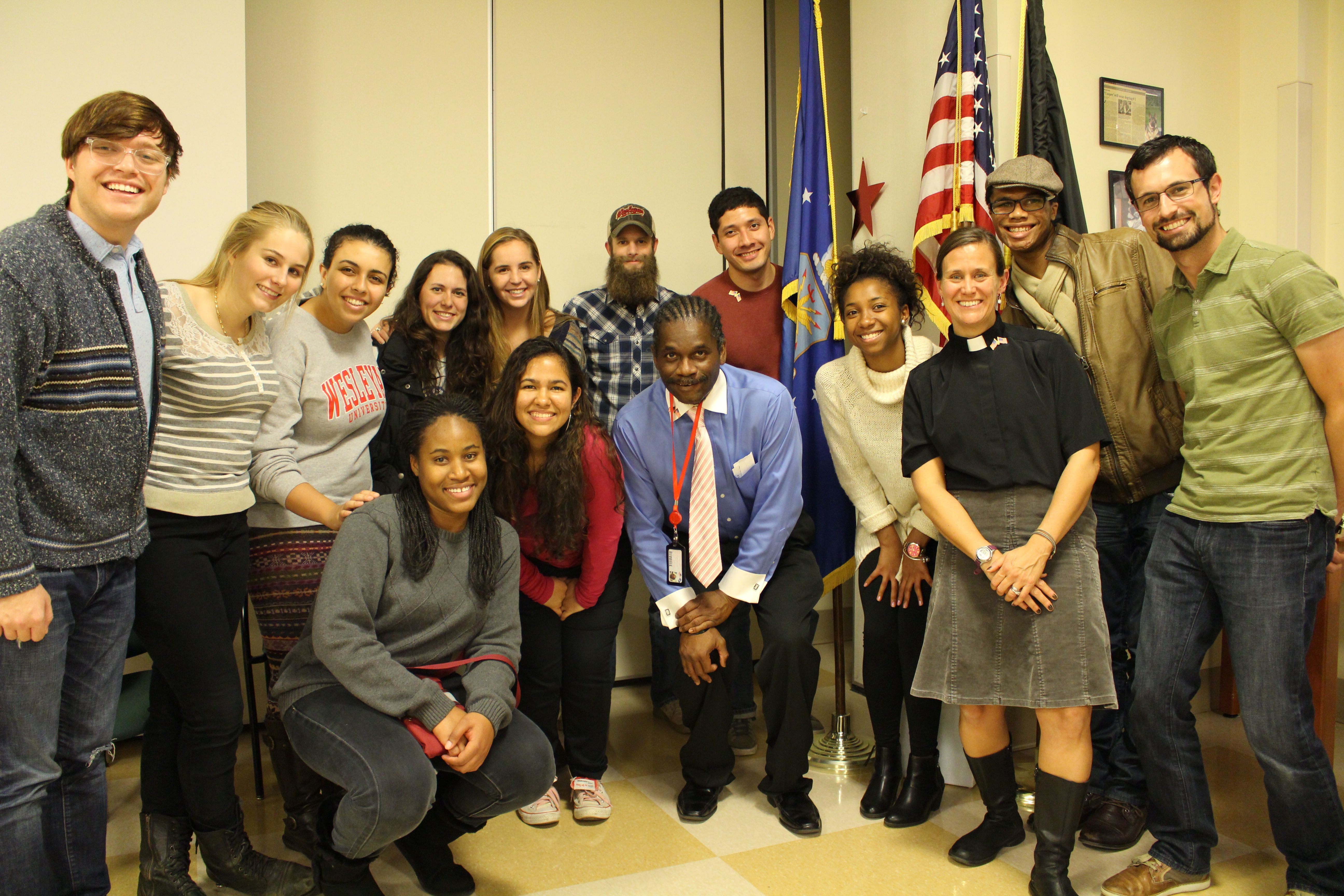 A group of Wesleyan students, led by University Protestant Chaplain Tracy Mehr-Muska, visited the Connecticut State Veterans Home in Rocky Hill on Nov. 8, just ahead of Veterans Day. The twelve students—including two Posse Veteran Scholars—visited with the veterans, sang patriotic songs, and pinned American flag pins on their lapels in honor of their military service. They were joined by Mehr-Muska's chaplain intern from Yale Divinity School, Jonathan Heinly, and the chaplain at the Veterans Home. Among the veterans they met was a 101-year-old man who served as a member of the Tuskegee Airmen.