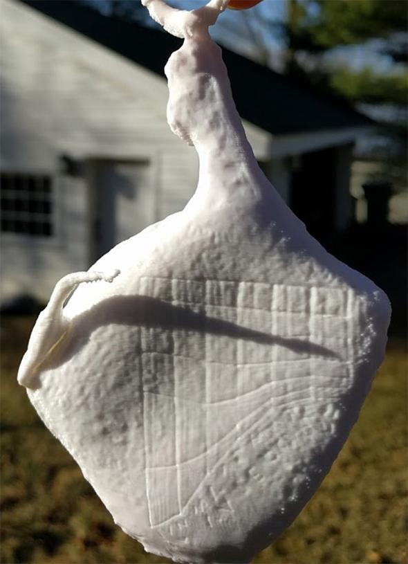 A model of the "pork clock" sundial shows the time as 9 a.m. (Photo by Christopher Parslow. 3-D print by Christopher Chenier) 
