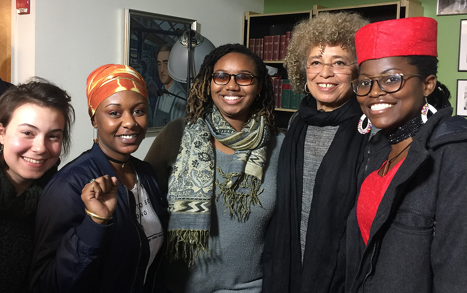 At left, Sara Feldman '17, Gabe Hurlock '20, Kaiyana Makami '19, Angela Davis and Claudia Khahindi '19 gather at the "We're Not Going Back" Unity Rally in New York City on March 4. 