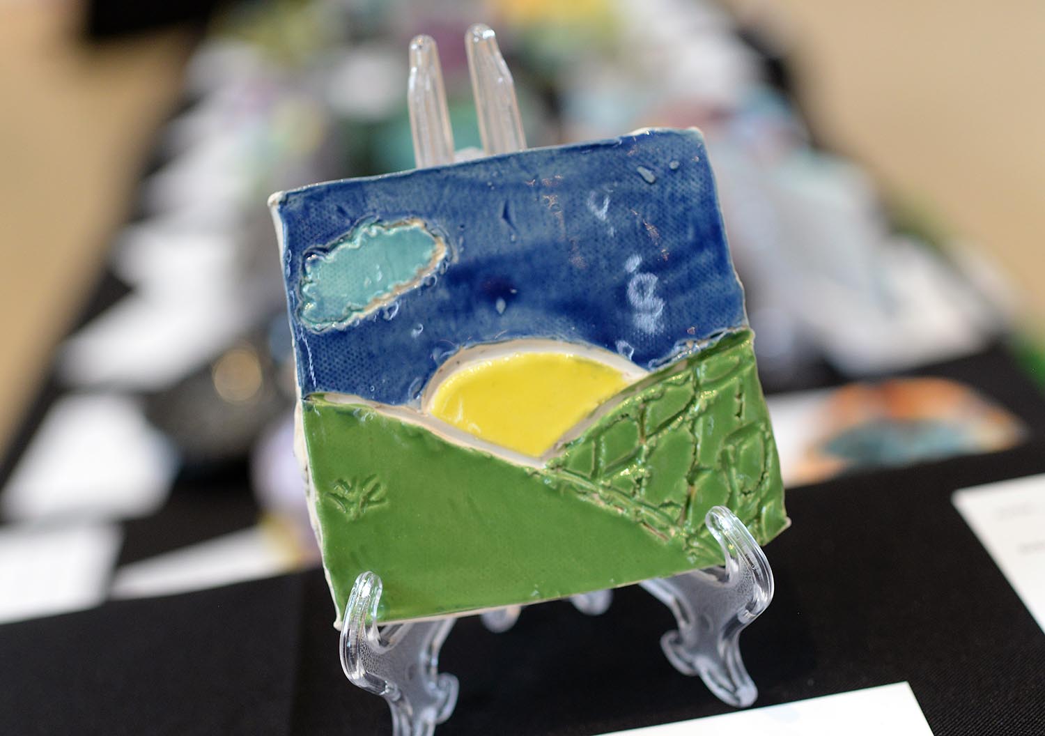 Madelyn, a third-grader from Moody School, made this tile from clay. 