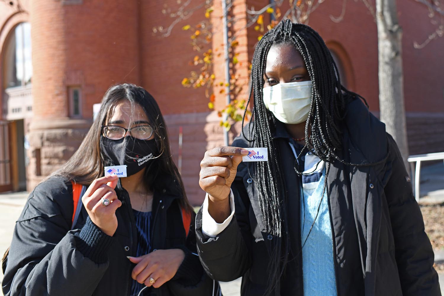 Students showed off their “I Voted” stickers after casting their ballots on Nov. 3. Wesleyan students, faculty, and staff, as well as Middletown residents in Voting District 14, turned out to vote at the polling place in Beckham Hall.
