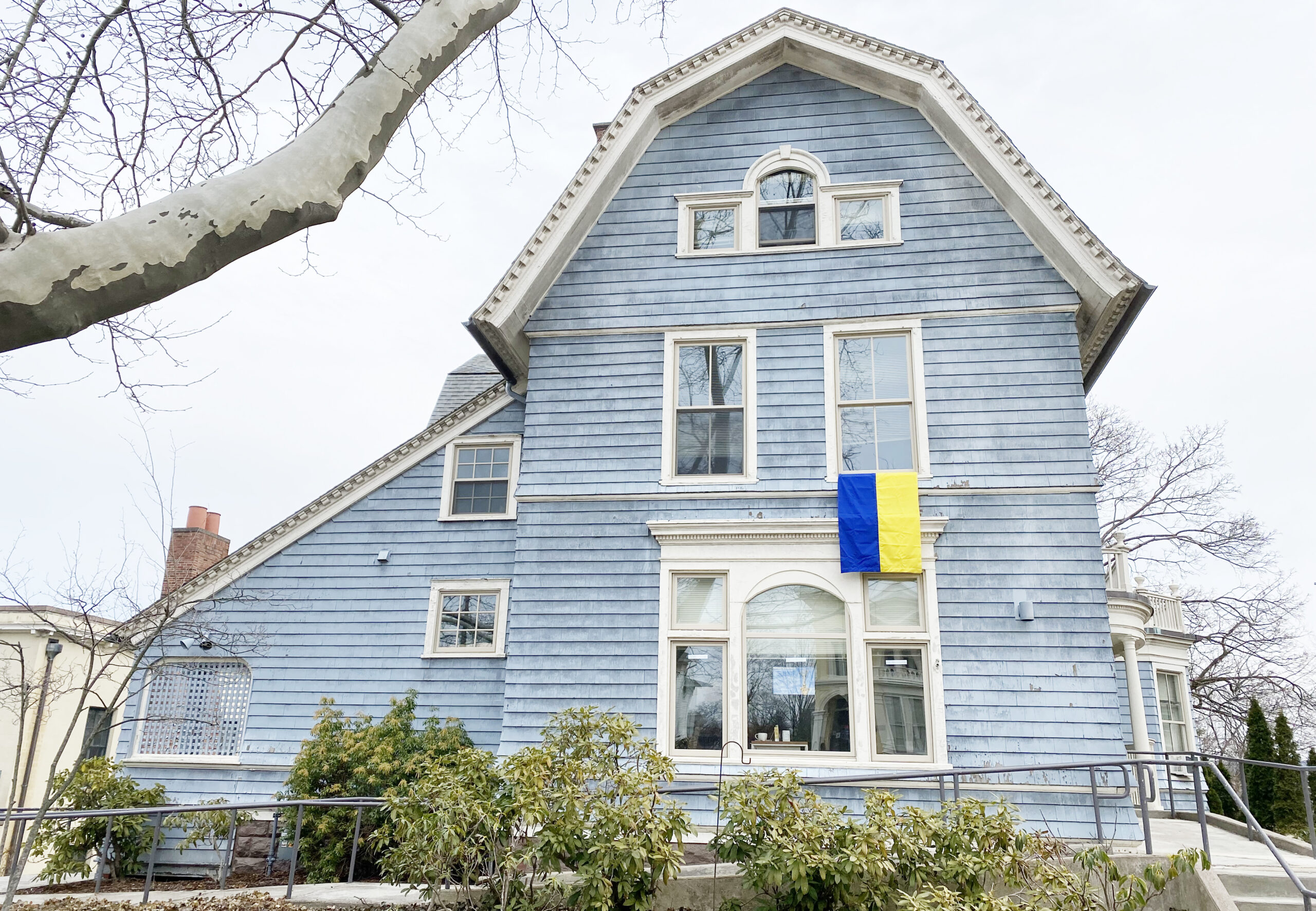 The College of the Environment, which has co-sponsored several of the Ukraine events, displays a Ukraine flag from its building on High Street. (Photo by Laurie Kenney)