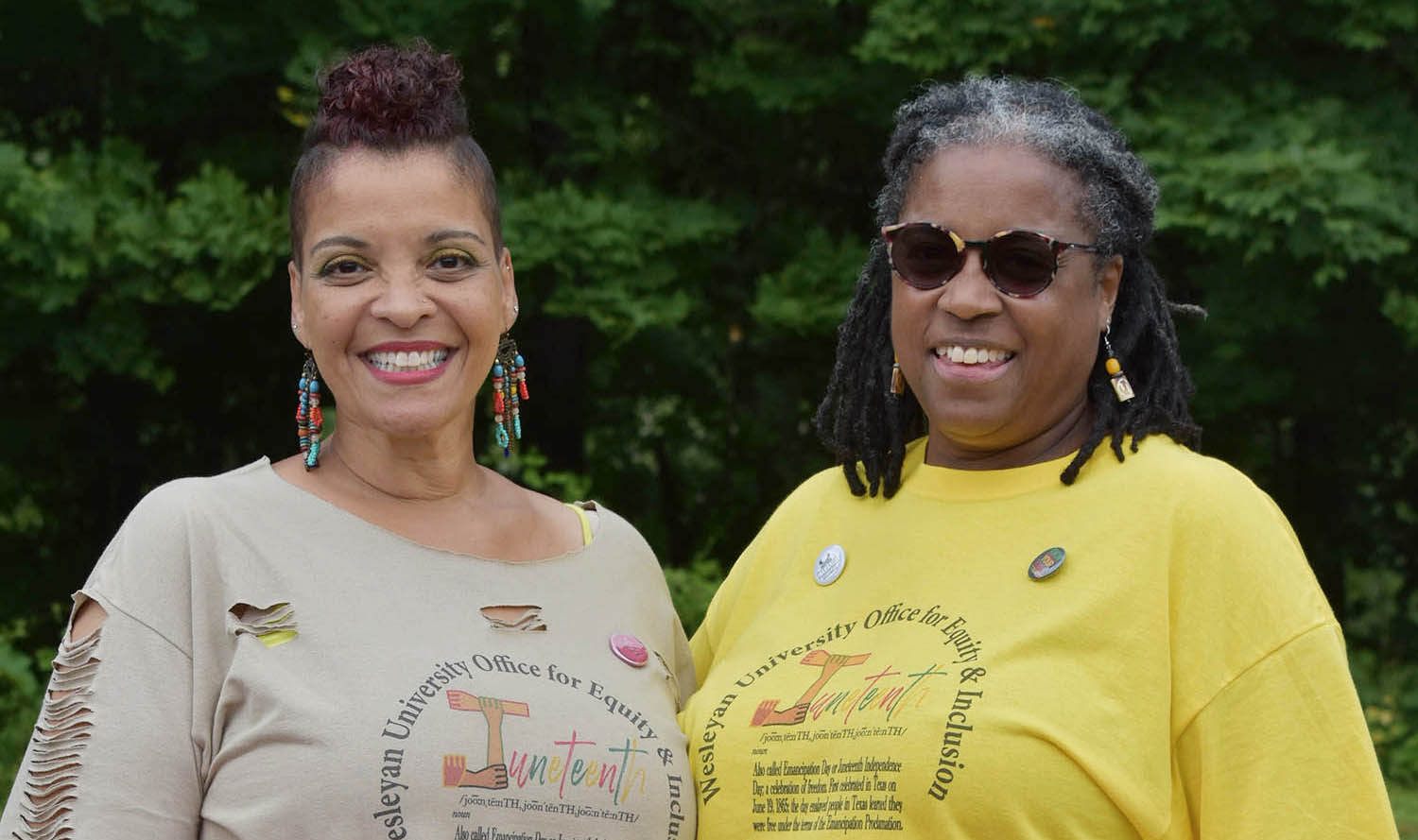 Evelyn Bozeman, administrative assistant for the Office for Equity and Inclusion, and Alison Williams '81, vice president for equity and inclusion, proudly display their Juneteenth signs during the City of Middletown's Juneteenth Liberation.