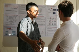 Sattanathan Paramasivan, a graduate student in the chemistry department, talks about his research during a poster session.