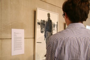 Will Krieger '11 looks at a photograph from An-My Le's "29 Palms."