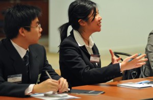 Arion Blas '11 and Kaishi Lee '09 listen to a talk at J.P. Morgan Chase in New York City on Oct. 27 during Wesleyan's Management and Leadership Conference. 