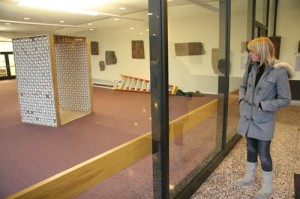 Briana Nixon '11 checks out the paper cup sculpture in Exley Science Center. 