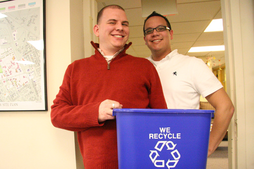 Jonathan Curry, TITLE, and Alex Cabal, area coordinator, have replaced their plastic trash cans with recyclable containers in Residential Life. 