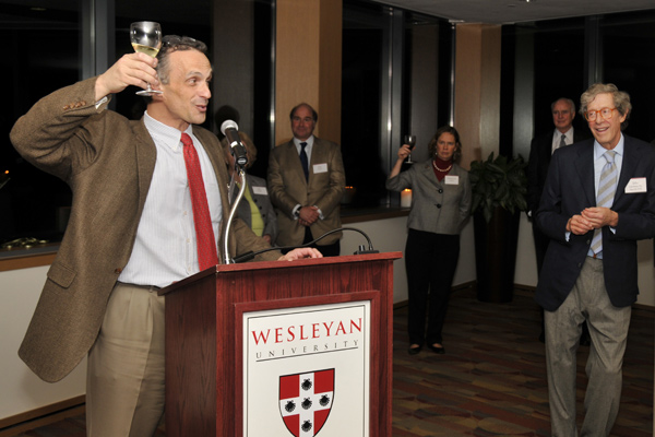 Wesleyan President Michael Roth leads a toast to the Daniel family. 