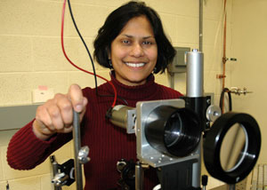 Ishita Mukerji, professor of molecular biology and biochemistry, uses a UV resonance Raman spectrometer to measure molecular vibrations. She examines the structure of DNA, to understand how protein modulation of the structure can lead to tumors and other diseases.