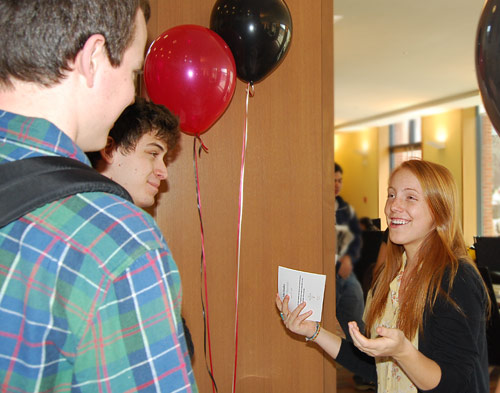 At right, Katherine Eyster '10, speaks to students about the tuition transition. Wesleyan's tuition, room and board costs about $69,000 a year. Students pay $49,000, and a tuition grant from alumni and parents through the Wesleyan Fund, along with the endowment, picks up the additional $20,000 per student. 