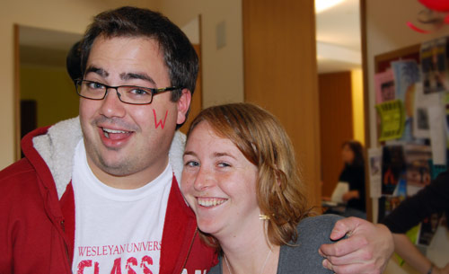 Ruby Ross '09 volunteered to paint a red "W" on students' cheeks during the event. At left is Erik Underwood '09.