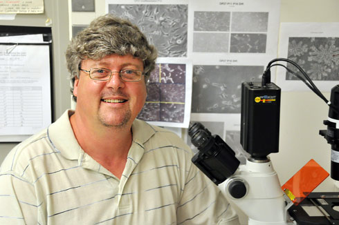 Robert Lane, associate professor of molecular biology and biochemistry, is researching a a complex odorant receptor gene regulatory system. (Photo by Olivia Drake) 