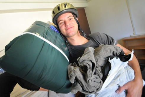 Noah Klein-Markman '13 of Berkley, Calif., unloads his belongings inside his Butterfield Residence Hall room at 8:30 a.m. Sept. 1. His parents, Laura Klein and Henry Markman, and brother, Sam, helped Noah move in.