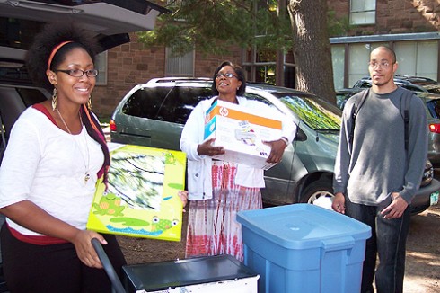 Jacquelynn West '13, left, moves into Butterfield Residences with the help of her family.