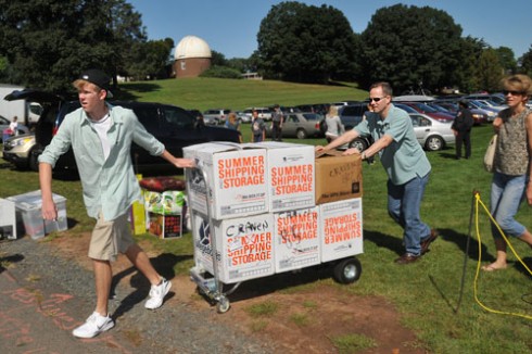 Families parked on Andrus Field and moved items into Clark Hall. 