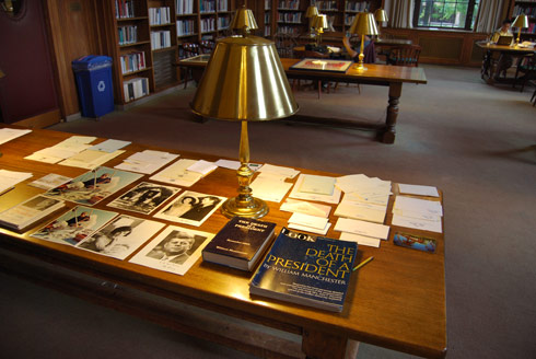 The silent auction included collectible titles and older, scares and unusual items. Pictured here, JFK memorabilia awaits bidding at the silent auction in the Smith Reading Room. 