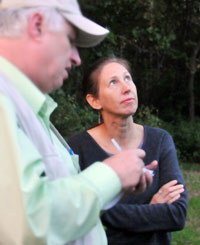 Miller explains to a newspaper reporter that bats, fish and aquatic macroinvertebrates are dependent on the habitat characteristics of the stream and the landscape.