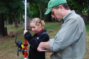 John Hinchman, a lecturer and research specialist in the Architectural Conservation Laboratory of the Historic Preservation Program at the University of Pennsylvania, teaches Anne Calder '11 how to conduct a digital site survey using a total station. The equipment records the 3-D location of the corner of each stone on the site, and results in an accurate representation of the cemetery. Calder is enrolled in the class, "The Study of Material Culture: Marking the Past in Middletown."