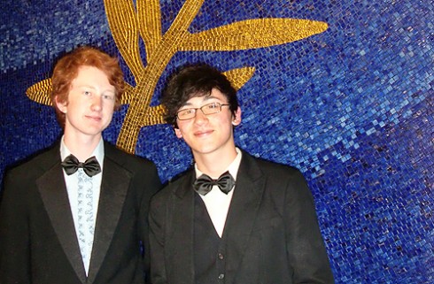 Nathaniel Draper '12 and his friend Matt Firpo (NYU '12) stand in front of Festival de Cannes emblem in the Grand Lumiere Theater. Draper was an intern at the Festival de Cannes. 
