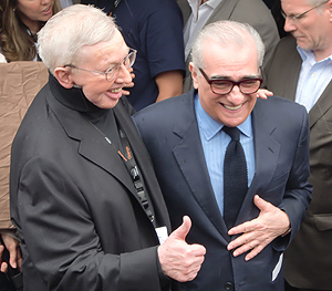 Draper snapped this photo of Martin Scorsese and Roger Ebert in front of the American pavilion, as Martin presents Roger with the dedication of the American Pavilion conference center as the new "Roger Ebert Conference Room."