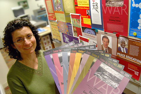 Jennifer Platt, printing specialist for Information Technology Services, shows samples of posters she printed in the ITS Print Shop located in Usdan University Center. 