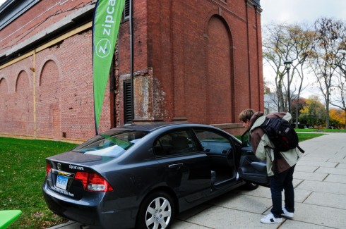 Charlie Kurose '10 checks out one of the two Zipcars that will be used by Wesleyan students. To sign up for Zipcar use, students over the age of 18 need a valid driver's license and a credit card. 
