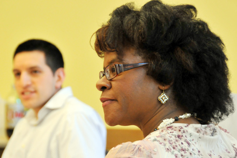 From left, Rommel Guadalupe, assistant director of institutional research, and Maggie Taylor, Public Safety officer, listen to their peers during the Nov. 16 meeting of the Administrators and Faculty of Color Alliance (AFCA). AFCA, a volunteer organization comprised primarily of administrators, faculty, and staff of African, Latino, Native American, and Asian descent, provides fellowship and support to all students, faculty, and staff on campus paying particular attention to the needs of the people of color in the community.