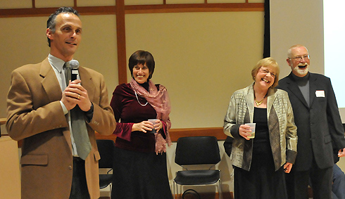 From left, Wesleyan President Michael Roth and Vera Schwarcz, the Mansfield Freeman Professor of East Asian Studies, director of the East Asian Studies Program and professor of history, share stories about Shirley Lawrence, third from left, who is retiring as program coordinator of the East Asian Studies Program. Lawrence is pictured with her husband, Ted. 