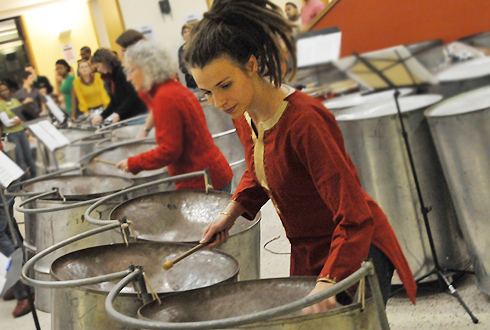 Brandi Cahill, assistant director of the Office of University Events, performs on steel drums during the "Pannin' the Night Away: Steel Band Live" concert Dec. 13 in Usdan University Center. The Wesleyan staff steel band opened. 