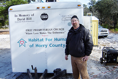 Jeff Gilarde, director of scientific imaging in the Biology Department,  spent his holiday vacation volunteering with the Habitat for Humanity of Horry County, near Myrtle Beach, S.C. Gilarde is pictured here near the tool trailer on Dec. 30, where the temperature was 38 degrees. 