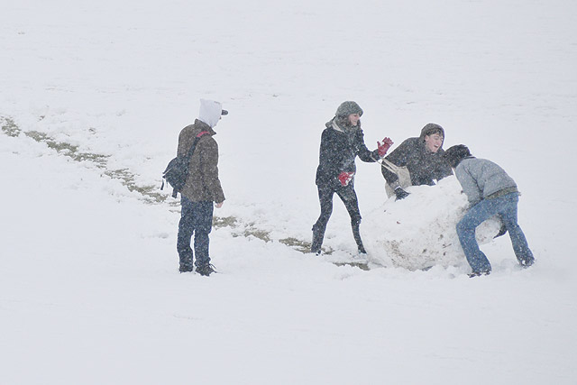 Students rolled a snowball from the top of Foss Hill to the back of Usdan University Center.