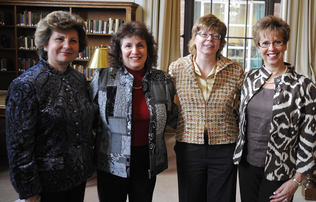 Pat Tully, third from left, hosted a reception March 4 in the Smith Reading Room to honor three long-time library staff members who are retiring from Wesleyan this year. The librarians are, from left, Roberta Raczka, Science Library assistant in circulation; Linda Marquis, Science Library assistant in access services and at far right, Ann Marino, Olin Library administrative assistant and facilities coordinator. 
