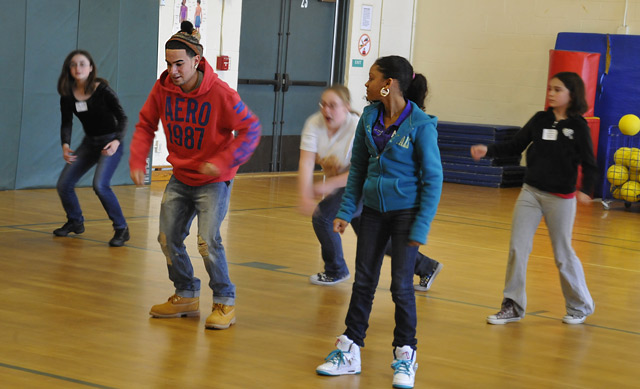 Wesleyan's Green Street Art Center instructors Eric Quinones (in red) and Kassandra Feliciano (in blue) taught a hip-hop dance workshop during Minds in Motion. 