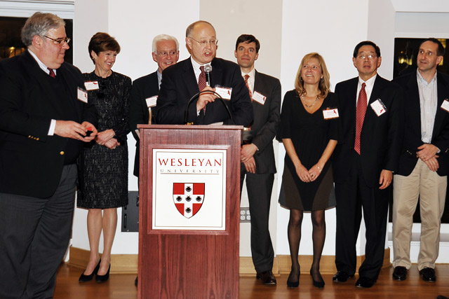 Richard Swanson '77, chair of the Wesleyan Fund, speaks during the 2010 Volunteer Weekend dinner and reception Feb. 26 in Beckham Hall.  Several alumni and parent volunteers were honored for their volunteer service. Also pictured, from left, are Joe Fins ‘82; Moira McNamara James ’78, P’10; John Driscoll ’62; Brendan Coughlin ’95; Bonnie LePard ’82; Leo Au ‘71 and Dave Bartholomew ’81.