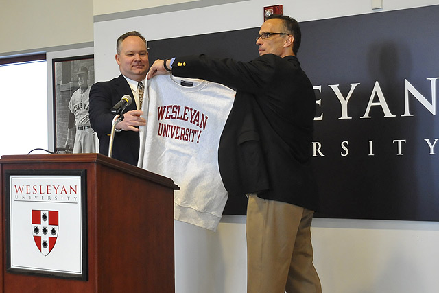 Wesleyan President Michael Roth, right, introduced new football head coach Mike Whalen '83, left, to the Wesleyan community during a ceremony March 8 in the Freeman Athletic Center. Whalen, the 2006 NESCAC Coach of the year, comes to Wesleyan from Williams College, where he had been the head coach since 2004. Whalen also will serve as Wesleyan's assistant athletic director. 