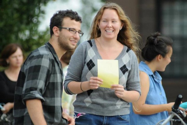 Oren Finard '14 and Megan Cash '14 mingle behind Usdan University Center on Sept. 7.