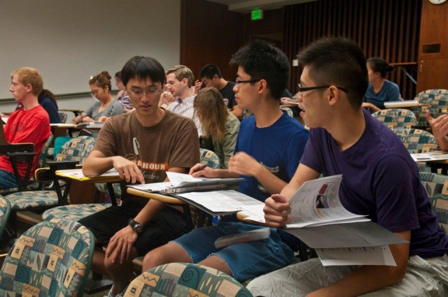 Classmates Lee Chen '15, Ryan Graff '14 and David Mai '15 work on an assignment together.