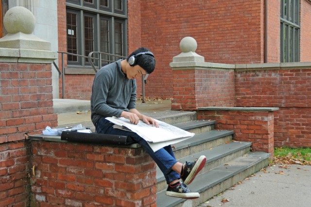 Kotaro Aoki '16 makes a sketch outside 200 Church on Sept. 26. Aoki is enrolled in Drawing I this semester.