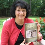 Nadine Angress ’90, daughter of the late Werner "Tom" Angress ’49, holds a copy of her father's book.