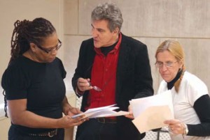 Ron Jenkins, center, rehearses with former inmates Saundra Duncan and Lynda Gardner. (Photo by Steve Miller)