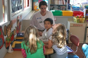 Olivia Tempest '13 works with children at Farm Hill Elementary School in Middletown.