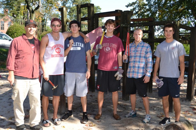 A rotating crew made up of the Wesleyan baseball team helped remove a 23-year-old wooden playscape at the Neighborhood Preschool Oct. 5. Team members arriving for the earliest shift are, from left, Coach Mark Woodworth '94; Jimmy Hill ’14 of Glastonbury, Conn.; Jordan Farber '16, of  Livingston, N.J.; Jeff Blout ’14 of Duxbury, Mass.; Chris Law ’14 of Dover, Mass.; and Kai Kirk '16 of San Jose, Calif.