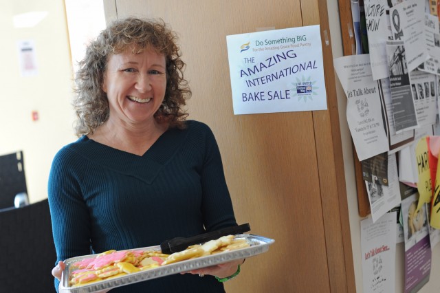 Sherri Condon, accounting specialist in Auxiliary Operations and Campus Services, displays a tray of Canadian sugar cookies during the International Bake Sale Nov. 14 in Usdan University Center. Through baked goods and pumpkin pie sales, Wesleyan raised $900 for the Amazing Grace Food Pantry in Middletown.